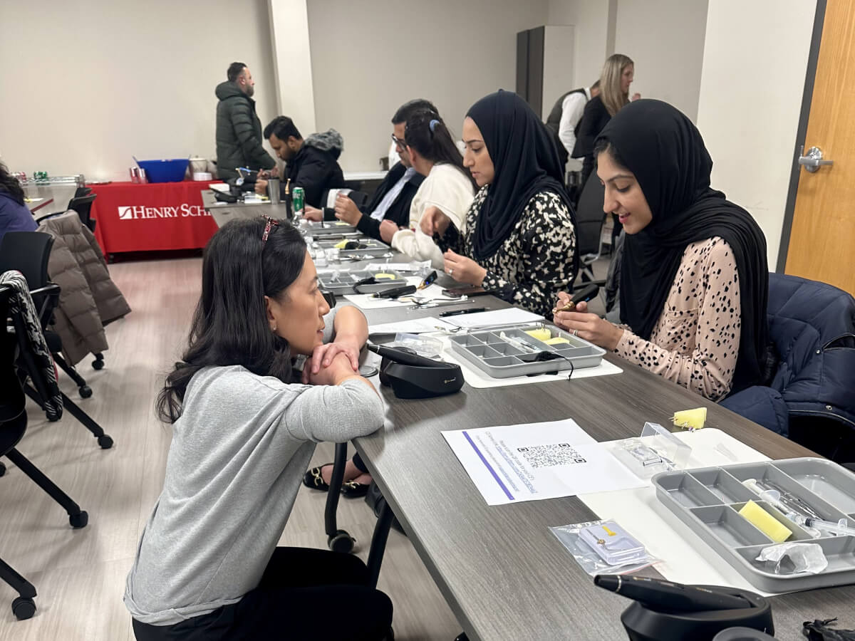 Dr. He is guiding participants in a clinical hands-on workshop in Chicago, Illinois.