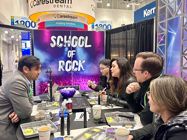 A group sitting at a table with various EdgeEndgo products.