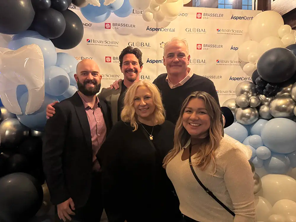 EdgeEndo team members posing together surrounded by balloons.